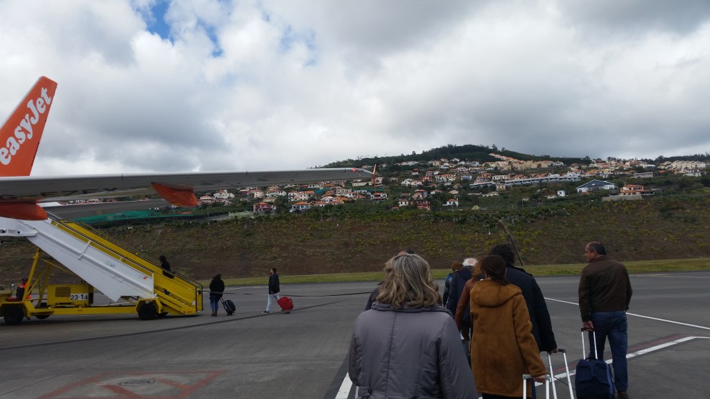 Boarding an easy Jet flight in Madeira, Portugal. No luxurious ramps for budget flights- you get to walk directly on the tarmac!
