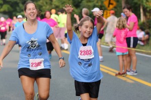 Mother and daughter cross the finish line at the Women's Four Miler, Virginia's largest women's footrace benefiting breast cancer research